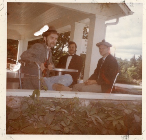 Download the full-sized image of Photograph of Rupert Raj Sitting at a Table with Two Others