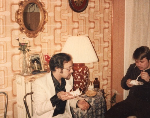 Download the full-sized image of Photograph of Rupert Raj in a Suit Eating Cake