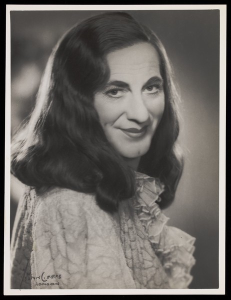 Download the full-sized image of An actor in drag, posing for a portrait. Photograph by Mme Yvonne, 194-.